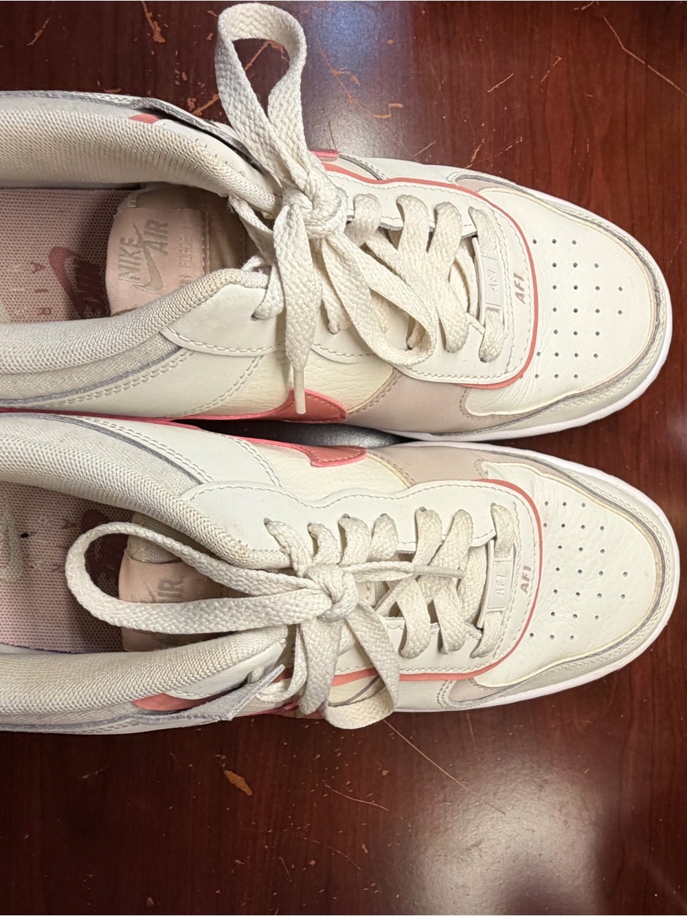 Nike Women’s Low-Top Sneakers in White with Pink Accents